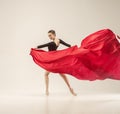 Modern ballet dancer dancing in full body on white studio background. Royalty Free Stock Photo