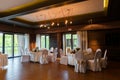 Modern banquet hall. Decorated tables, elegant setting, beautiful interior