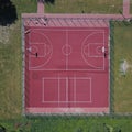 Modern basketball court in the courtyard on the centre of municipal sports and recreation. View of bird`s fly or drone. Modern bas Royalty Free Stock Photo