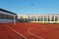 Modern basketball court in the courtyard of primary school. Multifunctional children`s playground with artificial surfaced fenced