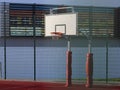 Modern basketball court in the courtyard of primary school. Multifunctional children`s playground with artificial surfaced fenced Royalty Free Stock Photo