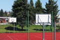 Modern basketball court in the courtyard of primary school. Multifunctional children`s playground with artificial surfaced fenced Royalty Free Stock Photo