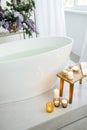 Modern bath room and spa center on the white tub wooden table Royalty Free Stock Photo