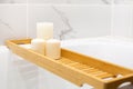 Modern bath room with wooden table and candles. White marble background wall Royalty Free Stock Photo