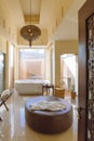 Modern bathroom area with bath tub and sofa inside in the morning at Abu Dhabi, UAE Royalty Free Stock Photo