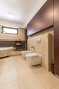 Modern bathroom with beige tiles Royalty Free Stock Photo