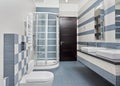 Modern bathroom in blue with shower cubicle Royalty Free Stock Photo