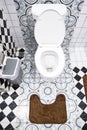 Modern bathroom design featuring artistic wall patterns and checkerboard tiles. Royalty Free Stock Photo
