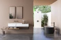 Modern bathroom interior with beige walls, marble basin with double mirror, bathtub, a open air shower Royalty Free Stock Photo