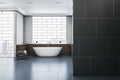 Modern bathroom interior with blank mock up place on wall, bathtub, abstract windows and reflections on concrete flooring. 3D Royalty Free Stock Photo