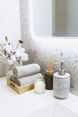 modern bathroom interior details with grey stone walls, hand towels, liquid soap Royalty Free Stock Photo