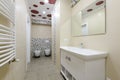 Bathroom interior, locker with mirror, toilet and bidet