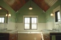 Modern bathroom interior with natural light and wooden accents Royalty Free Stock Photo