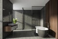 Modern Bathroom interior in new luxury home. Stylish hotel room. Open space area. Concrete wooden walls and floor. Bathtub and Royalty Free Stock Photo