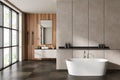 Modern bathroom interior with sink and tub, empty concrete wall Royalty Free Stock Photo