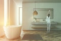 Modern bathroom interior, tub and sink, woman Royalty Free Stock Photo