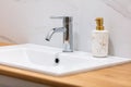 Modern bathroom sink with marble and wood details Royalty Free Stock Photo