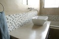 Modern bathroom sink with white mosaics