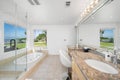 Modern bathroom with spacious glass shower and luxurious jacuzzi tub in Hidden Hills, CA Royalty Free Stock Photo