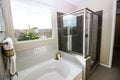 Modern Bathroom With Tub And Glass Shower Royalty Free Stock Photo