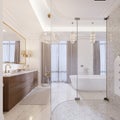 Modern bathroom with vanity and a mirror in a gold frame with sconces on the wall, a low table with decor, shower and a Royalty Free Stock Photo