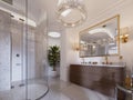 Modern bathroom with vanity and a mirror in a gold frame with sconces on the wall, a low table with decor, shower and a Royalty Free Stock Photo