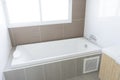 Modern bathroom with white bathtub. Royalty Free Stock Photo