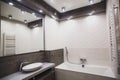 Modern bathroom in white and gray tones with mosaic on wide angle view Royalty Free Stock Photo