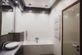 Modern bathroom in white and gray tones with mosaic on wide angle view Royalty Free Stock Photo