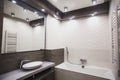 Modern bathroom in white and gray tones with mosaic on wide angle view Royalty Free Stock Photo