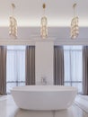 Modern bathroom with a window, hanging chandelier, curtains, bathroom