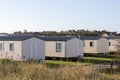 Modern beach holiday homes. A row of seaside vacation lodges Royalty Free Stock Photo