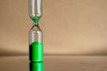 Modern beautiful green hourglass with bright background for copy space. Hourglass time passing concept for business Royalty Free Stock Photo