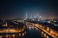 A modern beautiful night city on the river bank from a bird\'s eye view. Royalty Free Stock Photo