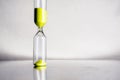 Modern beautiful yellow hourglass with bright background for copy space. Hourglass time passing concept for business Royalty Free Stock Photo