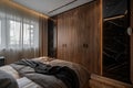 Modern beddroom furniture. wooden wardrobe with black marble doors