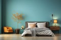 Modern bedroom with a bed, pillow and blanket, plant and wooden floor, minimal lifestyle, empty wall Royalty Free Stock Photo