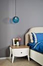 In a modern bedroom bed, pillows and bedside lamps Royalty Free Stock Photo