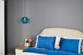 In a modern bedroom bed, pillows and bedside lamps Royalty Free Stock Photo