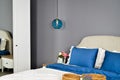 In a modern bedroom bed, pillows and bedside lamps Royalty Free Stock Photo