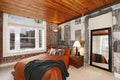 Modern bedroom with a broken concrete wall