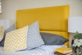 Modern bedroom detail yellow and white