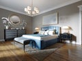 A modern bedroom in an eclectic style. With a double blue bed, black dressing table and chest of drawers with decor. beige walls Royalty Free Stock Photo