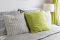 Modern bedroom with green pillow on bed Royalty Free Stock Photo