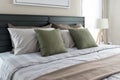 Modern bedroom with green pillows