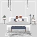 Modern bedroom interior. Couple of young adults lying in the double bed. Homosexual relationships. Gay partners. Royalty Free Stock Photo