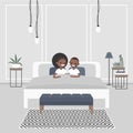 Modern bedroom interior. Couple of young african american adults Royalty Free Stock Photo