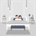 Modern bedroom interior. Couple of young caucasian adults lying Royalty Free Stock Photo