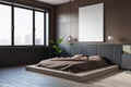 Modern bedroom interior with empty white mock up frame, window and city view. Hotel designs concept. Royalty Free Stock Photo