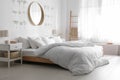 Modern bedroom interior with round mirror Royalty Free Stock Photo
